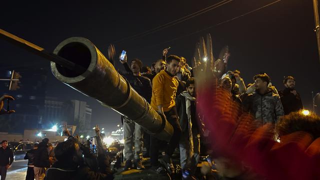 Des rebelles entrent dans Damas. [KEYSTONE - OMAR SANADIKI]