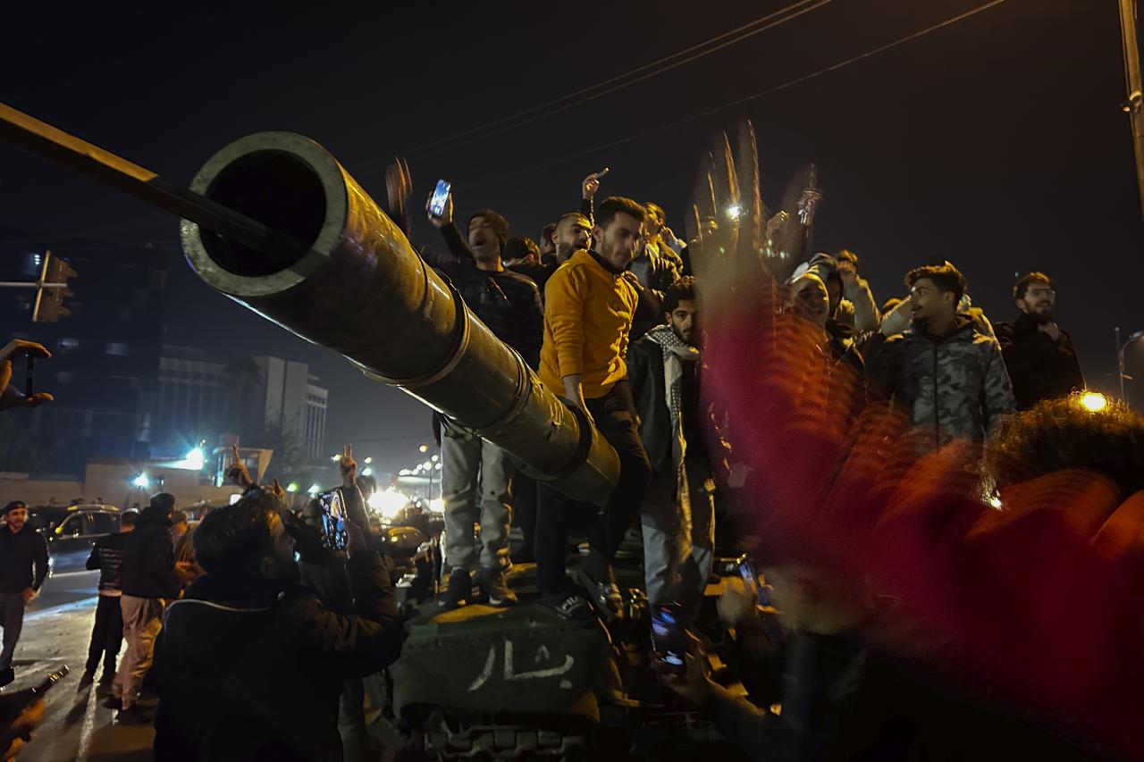 Des rebelles entrent dans Damas. [KEYSTONE - OMAR SANADIKI]