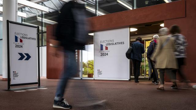 L'entrée des bureaux de vote à Palexpo. [Keystone - Martial Trezzini]