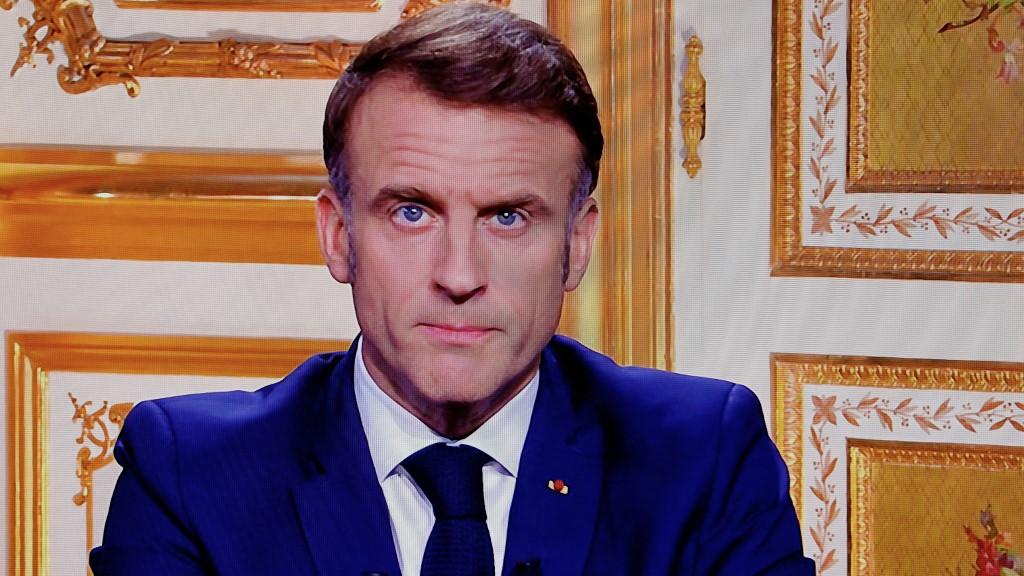 "J'exercerai mon mandat jusqu'à son terme", assure Emmanuel Macron dans son allocution. [AFP - LUDOVIC MARIN]