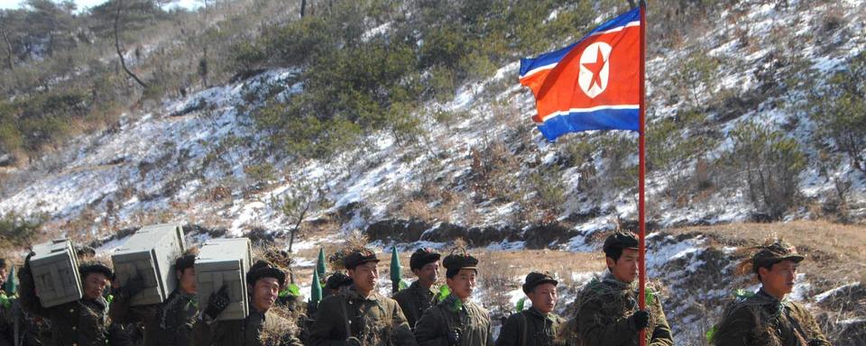 Une troupe de soldats de l'armée nord-coréenne en plein exercice, en 2013. [EPA/KEYSTONE - KCNA (photo d'Etat)]