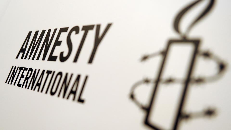 Le logo d'Amnesty International. [DPA / Keystone - Britta Pedersen]