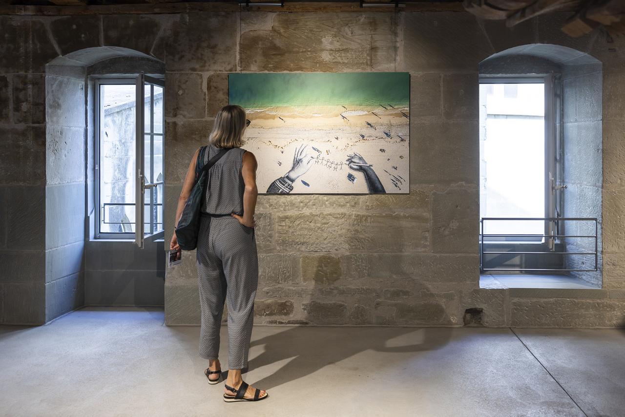 L'exposition des oeuvres de Saype est à voir en Basse-ville de Fribourg, à l'Atelier. [KEYSTONE - CYRIL ZINGARO]