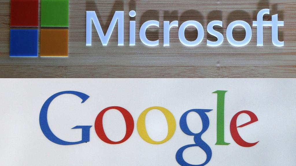 Les logos de Microsoft et Google. [AFP]