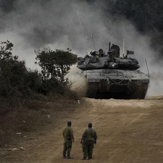 Israeli army tanks manoeuvre in a staging area in northern Israel near the Israel-Lebanon border, Tuesday, Oct. 1, 2024. (AP Photo/Baz Ratner) [AP Photo/Keystone - Baz Ratner]