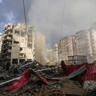 Smoke rises from the site of an Israeli airstrike in Beirut's southern suburb, Lebanon, Tuesday, Oct. 1, 2024. [AP Photo/Keystone - Hassan Ammar]