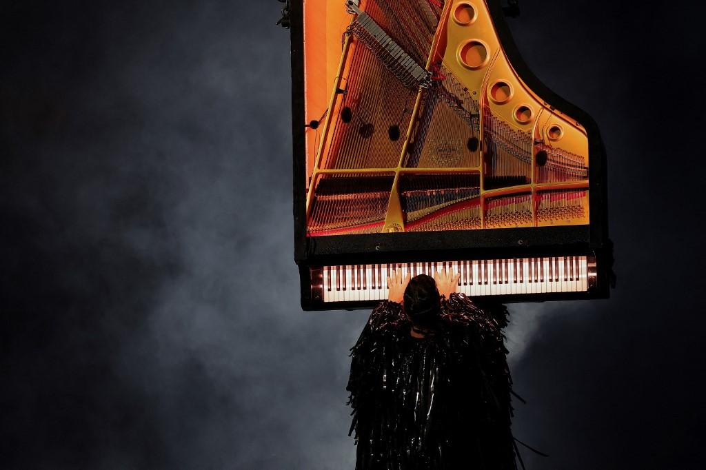 French pianist Alain Roche plays the "Hymne to Apollo" as French lyric tenor Benjamin Bernheim sings during the closing ceremony of the Paris 2024 Olympic Games at the Stade de France, in Saint-Denis, in the outskirts of Paris, on August 11, 2024. (Photo by FRANCK FIFE / AFP) [AFP - Franck Fife]