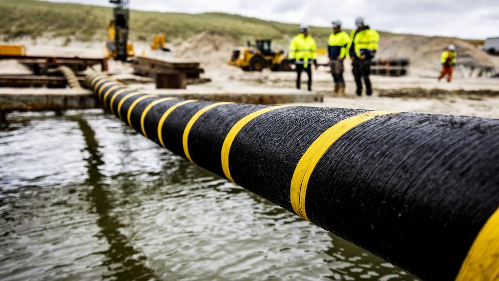 Un projet de câbles sous-marins acheminant de l'électricité entre l'Irlande à l'Amérique du Nord est en cours de développement (image d'illustration). [AFP - Jeffrey Groeneweg - ANP]