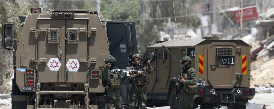 Des soldats israéliens, le 9 juillet 2024. [Keystone - EPA/Alaa Badarneh]