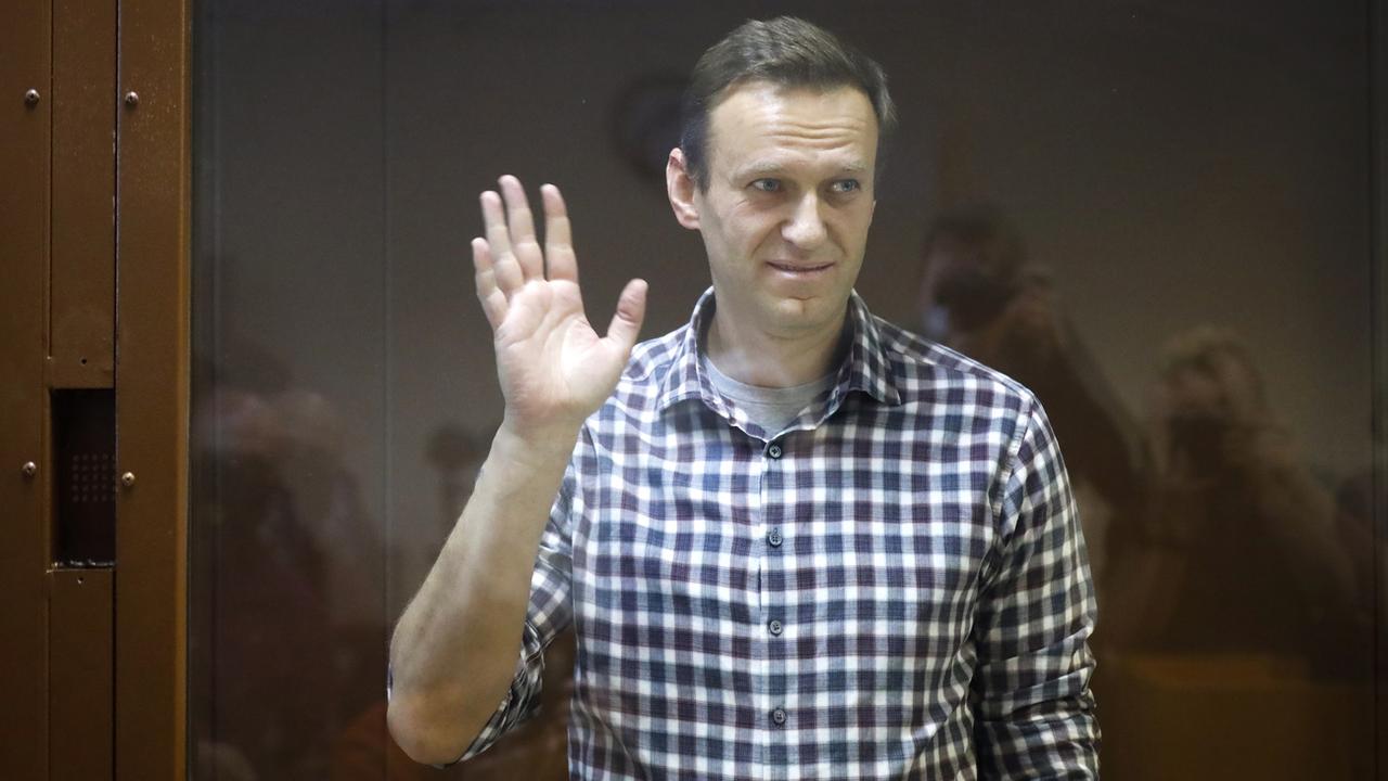 L'opposant russe Alexeï Navalny au tribunal, à Moscou, en Russie, en février 2021. [Keystone - ALEXANDER ZEMLIANICHENKO]
