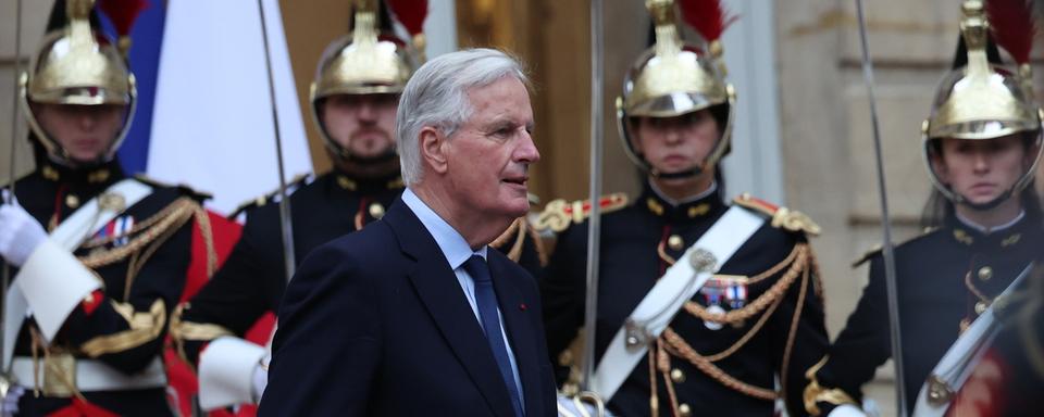 Michel Barnier lors de la passation de pouvoir à Matignon, le 5 septembre. [KEYSTONE - MOHAMMED BADRA]