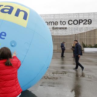 Dans sa deuxième semaine, les négociations piétinent à la COP29 de Bakou. [Keystone/EPA - Anatoly Maltsev]