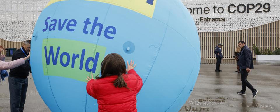 Dans sa deuxième semaine, les négociations piétinent à la COP29 de Bakou. [Keystone/EPA - Anatoly Maltsev]