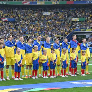 L'équipe d'Ukraine chantant son hymne national durant l'Euro 2024. [AFP - Miguel Medina]