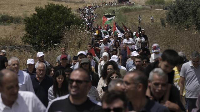 Des Palestiniens se rappellent la "catastrophe" ayant accompagné la création d'Israël, le 14 mai 2024. [KEYSTONE - MAHMOUD ILLEAN]