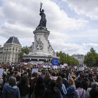 People take part in a gathering at Place de la Rebublique in support of 71-year-old Gisele Pelicot who was allegedly drugged by her ex-husband and raped by dozens of men while unconscious, Saturday, Sept. 14, 2024 in Paris. [AP Photo/Keystone - Michel Euler]