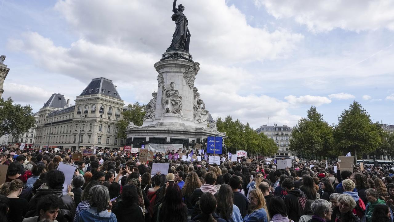 People take part in a gathering at Place de la Rebublique in support of 71-year-old Gisele Pelicot who was allegedly drugged by her ex-husband and raped by dozens of men while unconscious, Saturday, Sept. 14, 2024 in Paris. [AP Photo/Keystone - Michel Euler]