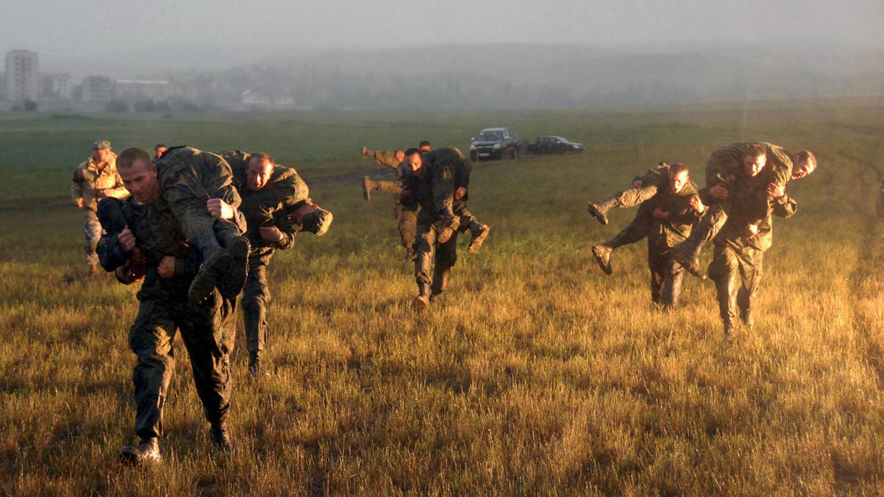 Des soldats géorgiens participant à un exercice militaire de l'OTAN contre la Russie. [Keystone/AP Photo - Nina Shlamova]