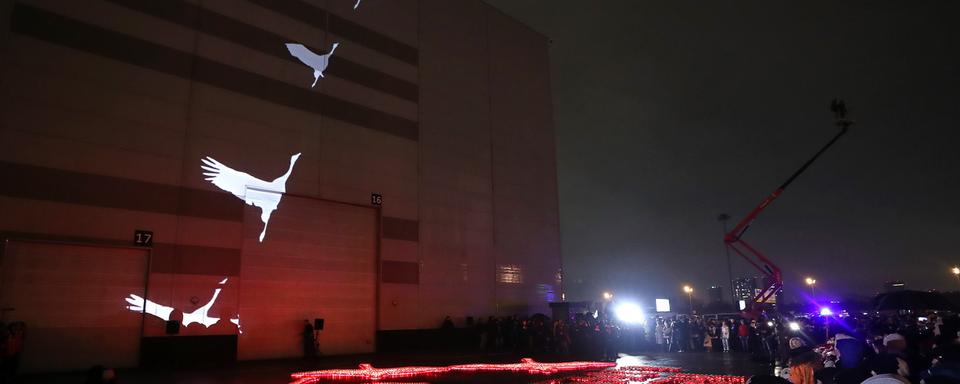 Cérémonie en hommage aux victimes de l'attaque terroriste dans une salle de concert de la périphérie de Moscou, le 24 mars 2024. [EPA/Keystone - MAXIM SHIPENKOV]