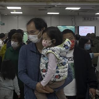 La hausse des cas du virus respiratoire MVPh en Chine est "normale", selon l'OMS. [Keystone - Andy Wong]