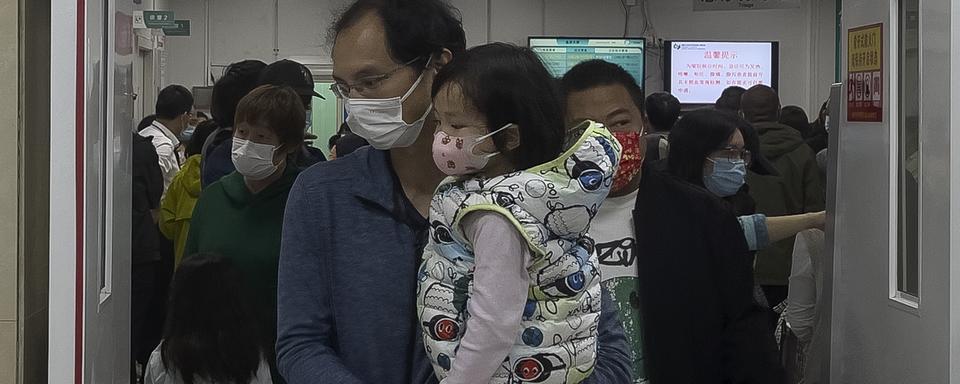 La hausse des cas du virus respiratoire MPVh en Chine est "normale", selon l'OMS. [Keystone - Andy Wong]