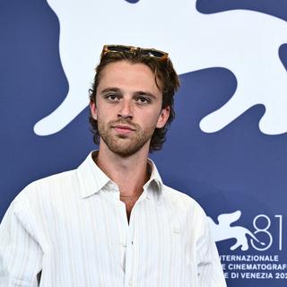 L'acteur Benjamin Voisin au 81ème Festival International du Film de Venise au Lido de Venise, le 4 septembre 2024 pour la présentation du film "Jouer avec le feu". [AFP - Marco BERTORELLO]