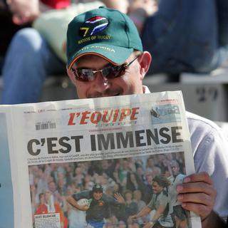 Le journal L'Equipe est une référence pour tous les amateurs de sports. [Michel Gangne]