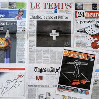 Unes des journaux suisses, le 8 janvier 2015, lendemain du massacre à "Charlie Hebdo". [Fabrice Coffrini]