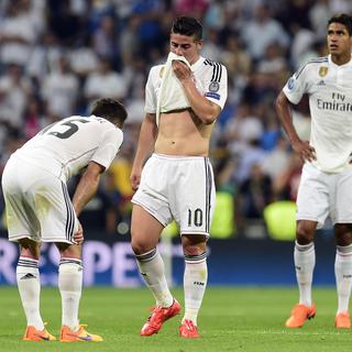 James Rodriguez réagit à la défaite de son équipe le Real Madrid contre la Juventus en demi-finale de la Champions League, le 13 mai 2015. [Gerard Julien]