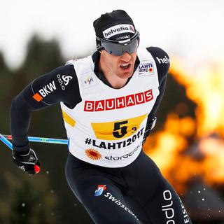 Dario Cologna en action aux championnats du monde de ski nordique de Lahti, en Finlande.
Peter Klaunzer
EPA Keystone [EPA Keystone - Peter Klaunzer]