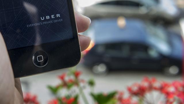 Les taxis Uber se commandent via l'application de la compagnie.
Christian Beutler
Keystone [Keystone - Christian Beutler]