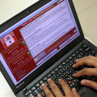 La cyber-attaque WannaCry a frappé 99 pays en mai 2017.
EPA/Ritchie B. Tongo
Keystone [Keystone - EPA/Ritchie B. Tongo]