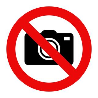 Droit d'interdire, oui, mais pas une interdiction générale de prendre des photos dans les magasins. [Fotolia - nikolae]