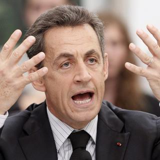 La force de persuasion du président Sarkozy. [GUILLAUME HORCAJUELO/Keystone]