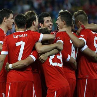 Les joueurs de l'équipe de Suisse de football jubilaient après leur victoire 1 à 0 face au Brésil. [Alexandra Wey - Keystone]