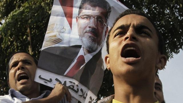 Les supporters de l'ex-président égyptien déchu Mohammed Morsi. [Amr Nabil / AP Photo]