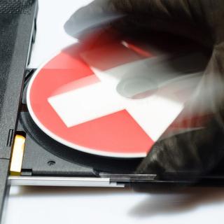 Comme avant, les CD de données volées n'entraîneront pas la coopérations des autorités suisses. [Christian Loose - Fotolia]