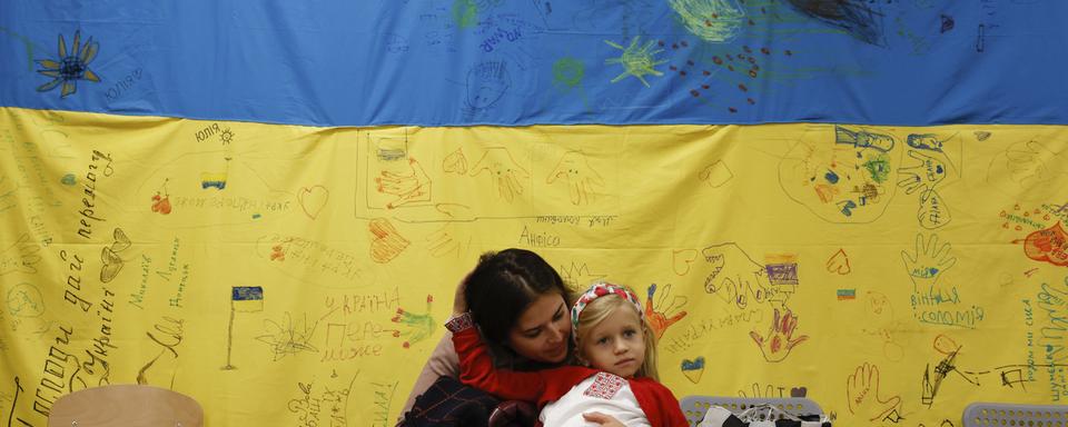 Un plan de mise en œuvre de la levée du statut S a été élaboré par le SEM.. [AP Photo - Michal Dyjuk]