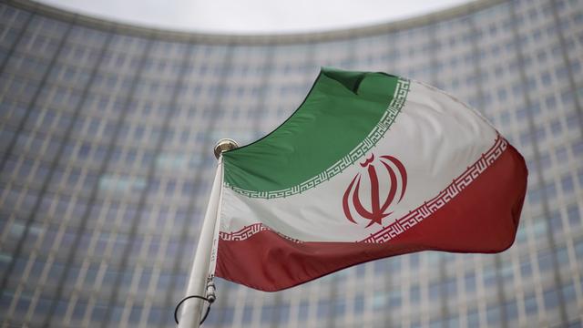 Le drapeau de l'Iran devant le siège de l'Agence internationale de l'énergie atomique (AIEA) à Vienne. [AP Photo - Michael Gruber]