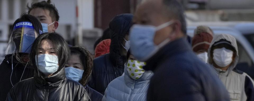 La Chine annonce un allègement général des règles sanitaires. [AP Photo - Andy Wong]