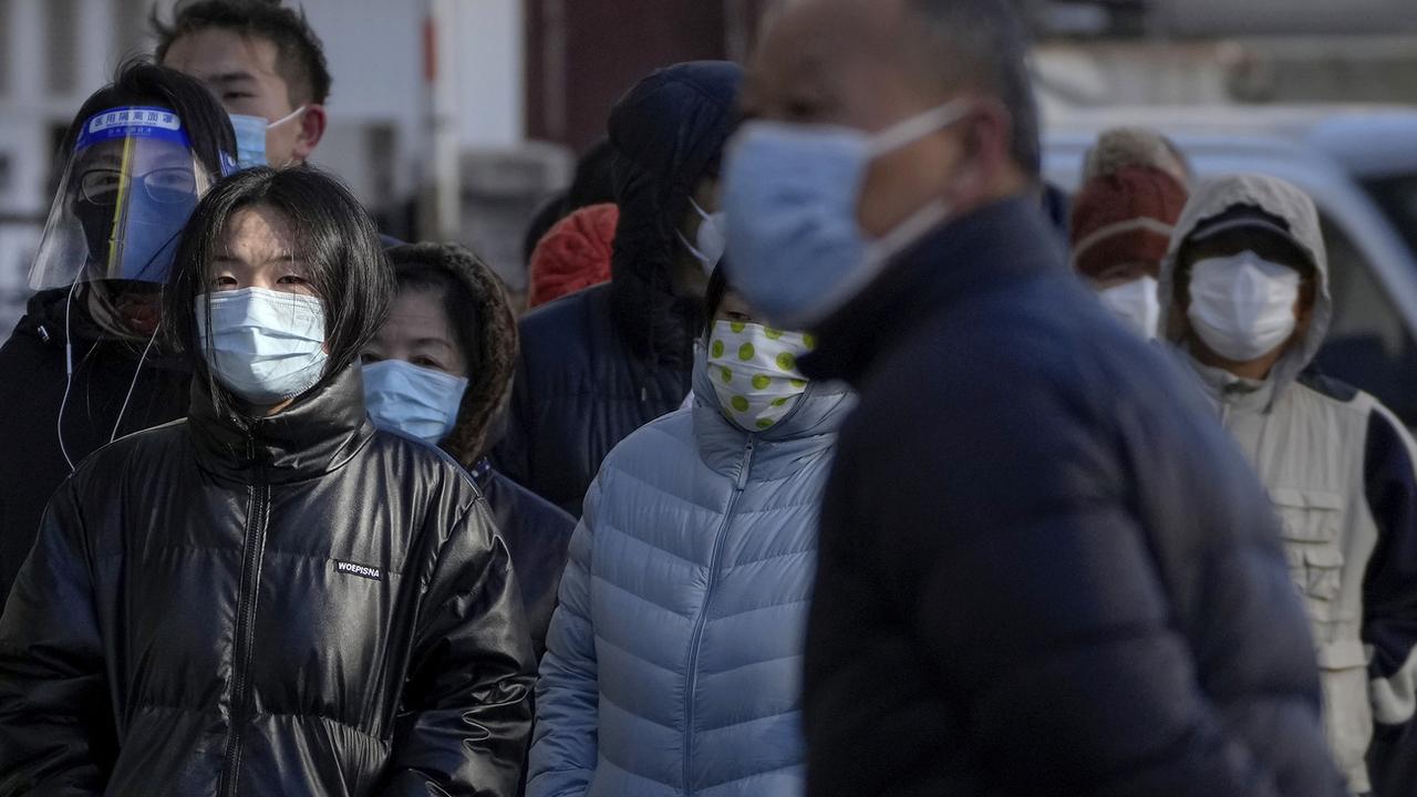 La Chine annonce un allègement général des règles sanitaires. [AP Photo - Andy Wong]