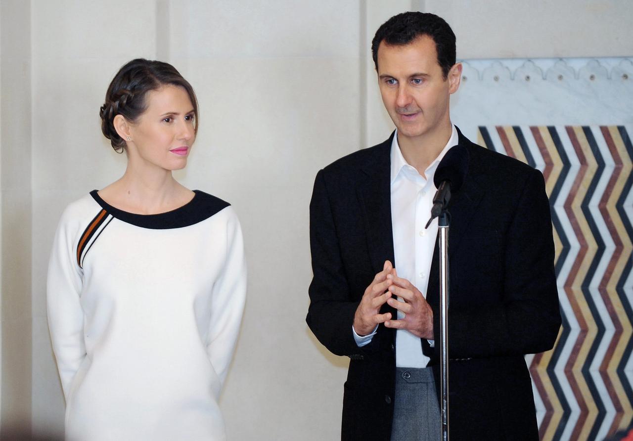 Une photo de Bachar al-Assad en compagnie de sa femme Asma, diffusée le 21 mars 2016. [KEYSTONE - SANA / HANDOUT]