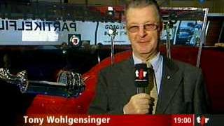 Salon de l'auto: interview de Tony Wohlgensinger, directeur d'Auto Suisse, et de Noëlle Petitdemange, porte-parole de l'association Transports et environnement (ATE). (1/2)