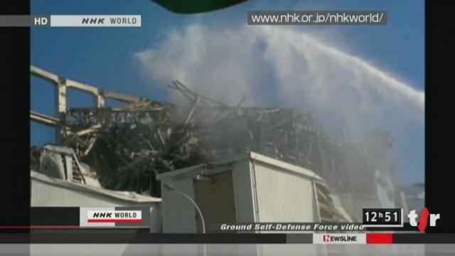 Japon/ risque de catastrophe nucléaire: les équipes de secours tentent de refroidir les réacteurs de centrale de Fukushima par tous les moyens