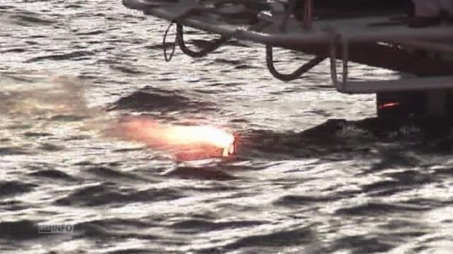 La flamme olympique plonge dans le lac Baïkal