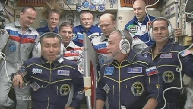La torche olympique dans la Station spatiale - ISS