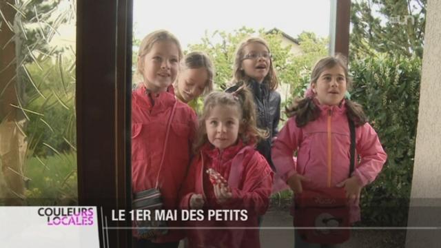 FR: les enfants célèbrent le 1er Mai en chantant