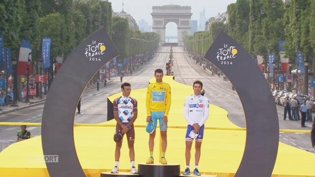 Vincenzo Nibali (ITA-1er), Jean-Christophe Péraud (FRA-2e) et Thibaut Pinot (FRA-3e) sur le podium du 101e Tour de France