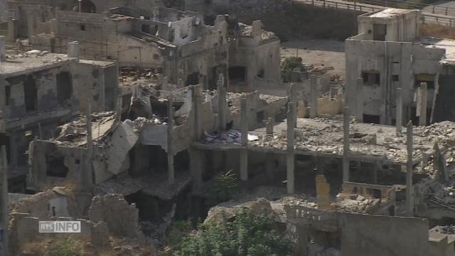 Plongée dans la ville de Homas, meurtrie par la guerre