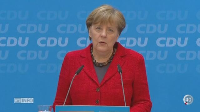 Allemagne: Angela Merkel maintient sa volonté d'accueillir les migrants malgré sa défaite aux régionales